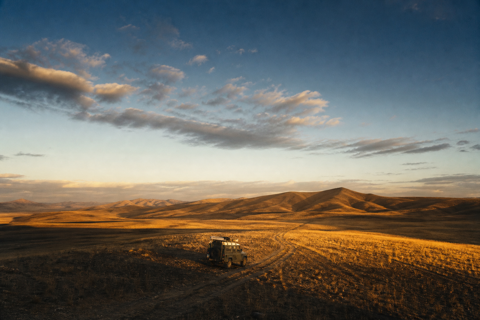 A lone vehicle in the vast Anatolian landscape